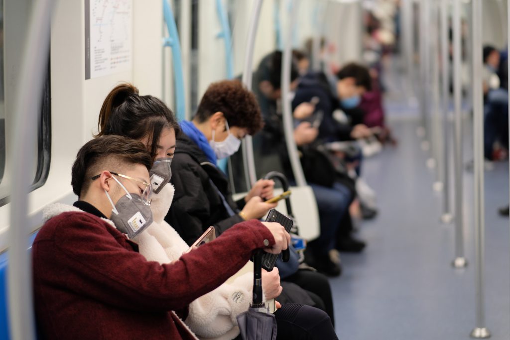 Shanghai/China-Jan.2020: New type coronavirus pneumonia in Wuhan has been spreading many cities in China. People wearing surgical mask sitting in subway in Shanghai