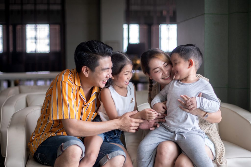 Family sitting on couch