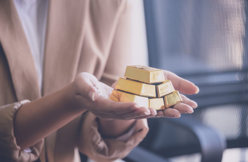 lady holding gold bars