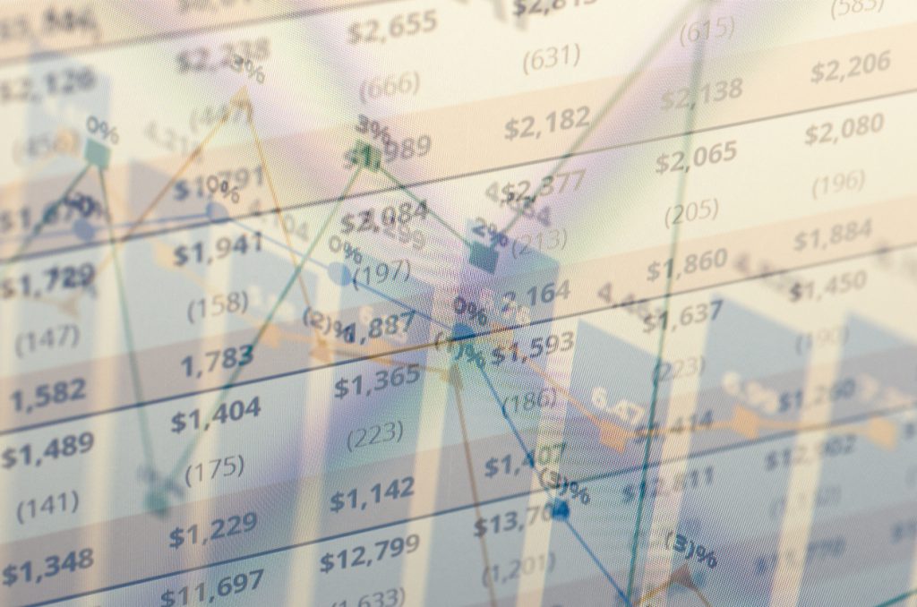 yield curve and close-up computer screen with financial data. Multiple exposure photo.